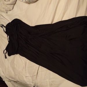 Black maxi dress with adjustable straps and v-neck.